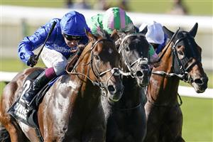 NEWMARKET, ENGLAND - SEPTEMBER 24: Oisin Murphy riding Benbatl (L, blue) win The Unibet 'You're On' Joel Stakes at Newmarket Racecourse on September 24, 2021 in Newmarket, England. (Photo by Alan Crowhurst/Getty Images)