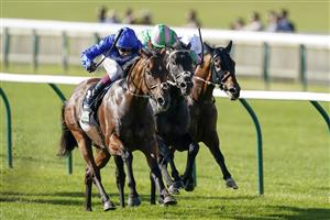 NEWMARKET, ENGLAND - SEPTEMBER 24: Oisin Murphy riding Benbatl (L, blue) win The Unibet 'You're On' Joel Stakes at Newmarket Racecourse on September 24, 2021 in Newmarket, England. (Photo by Alan Crowhurst/Getty Images)