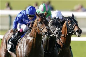 NEWMARKET, ENGLAND - SEPTEMBER 24: Oisin Murphy riding Benbatl (L, blue) win The Unibet 'You're On' Joel Stakes at Newmarket Racecourse on September 24, 2021 in Newmarket, England. (Photo by Alan Crowhurst/Getty Images)
