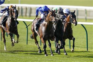 NEWMARKET, ENGLAND - SEPTEMBER 24: Oisin Murphy riding Benbatl (L, blue) win The Unibet 'You're On' Joel Stakes at Newmarket Racecourse on September 24, 2021 in Newmarket, England. (Photo by Alan Crowhurst/Getty Images)