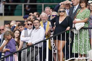 NEWMARKET, ENGLAND - SEPTEMBER 25: Racegoers look towards the big screen to watch the action at Newmarket Racecourse on September 25, 2021 in Newmarket, England. (Photo by Alan Crowhurst/Getty Images)