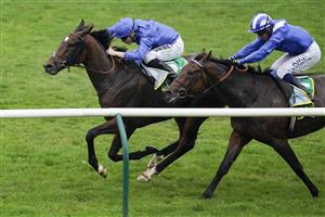 NEWMARKET, ENGLAND - SEPTEMBER 25: Jamie Spencer riding Bedouin's Story (L, blue) win The bet365 Cambridgeshire Handicap at Newmarket Racecourse on September 25, 2021 in Newmarket, England. (Photo by Alan Crowhurst/Getty Images)