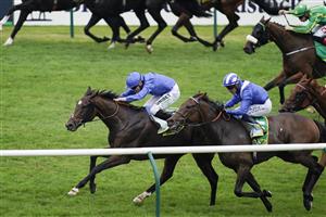 NEWMARKET, ENGLAND - SEPTEMBER 25: Jamie Spencer riding Bedouin's Story (L, blue) win The bet365 Cambridgeshire Handicap at Newmarket Racecourse on September 25, 2021 in Newmarket, England. (Photo by Alan Crowhurst/Getty Images)