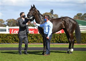 MELBOURNE, AUSTRALIA - SEPTEMBER 25: Trainer David Browne poses with Elephant after winning race 5, the Ladbrokes Sandown Stakes, during Melbourne Racing at Sandown Racecourse on September 25, 2021 in Melbourne, Australia. (Photo by Vince Caligiuri/Getty Images)