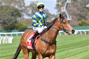 MELBOURNE, AUSTRALIA - SEPTEMBER 25: Josh Richards riding Esta La Roca after winning Race 1, the Tobin Brothers Celebrating Lives, during Melbourne Racing at Sandown Racecourse on September 25, 2021 in Melbourne, Australia. (Photo by Vince Caligiuri/Getty Images)