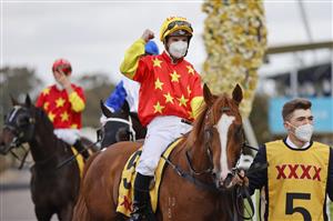 SYDNEY, AUSTRALIA - SEPTEMBER 25: Tim Clark on In The Congo returns to scale after winning race 8 the XXXX Golden Rose during Sydney Racing on Golden Rose Day at Rosehill Gardens on September 25, 2021 in Sydney, Australia. (Photo by Mark Evans/Getty Images)