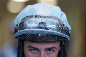 ASCOT, ENGLAND - OCTOBER 02: Jockey Rossa Ryan wears clingfilm on his riding goggles as rain falls at Ascot Racecourse on October 02, 2021 in Ascot, England. (Photo by Alan Crowhurst/Getty Images)