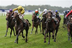 ASCOT, ENGLAND - OCTOBER 02: Tom Marquand riding With Thanks (yellow) win The World Mental Health Day British EBF Stakes at Ascot Racecourse on October 02, 2021 in Ascot, England. (Photo by Alan Crowhurst/Getty Images)