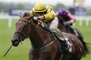 ASCOT, ENGLAND - OCTOBER 02: Tom Marquand riding With Thanks (yellow) win The World Mental Health Day British EBF Stakes at Ascot Racecourse on October 02, 2021 in Ascot, England. (Photo by Alan Crowhurst/Getty Images)
