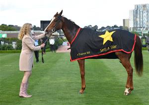 MELBOURNE, AUSTRALIA - OCTOBER 02: Monica Ryan poses with Still A Star after winning race 6, the Furphy Rose Of Kingston Stakes, during Melbourne Racing at Flemington Racecourse on October 02, 2021 in Melbourne, Australia. (Photo by Vince Caligiuri/Getty Images)