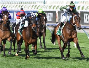 MELBOURNE, AUSTRALIA - OCTOBER 02: Brett Prebble riding Incentivise defeats Daniel Moor riding Young Werther in Race 7, the Tab Turnbull Stakes, during Melbourne Racing at Flemington Racecourse on October 02, 2021 in Melbourne, Australia. (Photo by Vince Caligiuri/Getty Images)