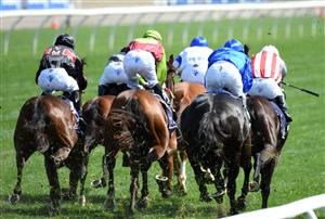 MELBOURNE, AUSTRALIA - OCTOBER 02: Damien Oliver riding Kementari (r) winning Race 4, the Gilgai Stakes during Melbourne Racing at Flemington Racecourse on October 02, 2021 in Melbourne, Australia. (Photo by Vince Caligiuri/Getty Images)