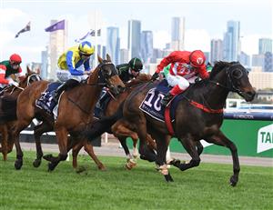MELBOURNE, AUSTRALIA - OCTOBER 02: Dean Yendall riding Justacanta winning Race 9, the Mcgregor Portables Paris Lane Stakes, during Melbourne Racing at Flemington Racecourse on October 02, 2021 in Melbourne, Australia. (Photo by Vince Caligiuri/Getty Images)
