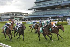 SYDNEY, AUSTRALIA - OCTOBER 02: Hugh Bowman on Montefilia (orange/blue), wins race 9 the Heineken Metropolitan during Sydney Racing on Epsom Day at Royal Randwick Racecourse on October 02, 2021 in Sydney, Australia. (Photo by Mark Evans/Getty Images)