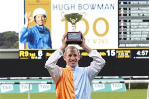 SYDNEY, AUSTRALIA - OCTOBER 02: Hugh Bowman poses with the Metropolitan trophy after reaching 100 group 1 wins during Sydney Racing on Epsom Day at Royal Randwick Racecourse on October 02, 2021 in Sydney, Australia. (Photo by Mark Evans/Getty Images)