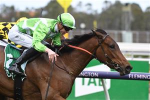 MELBOURNE, AUSTRALIA - OCTOBER 02: Jye McNeil riding Elusive Express winning Race 3, the Tab Edward Manifold Stakes, during Melbourne Racing at Flemington Racecourse on October 02, 2021 in Melbourne, Australia. (Photo by Vince Caligiuri/Getty Images)