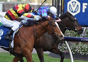 MELBOURNE, AUSTRALIA - OCTOBER 02: Luke Currie riding Still A Star winning race 6, the Furphy Rose Of Kingston Stakes, during Melbourne Racing at Flemington Racecourse on October 02, 2021 in Melbourne, Australia. (Photo by Vince Caligiuri/Getty Images)