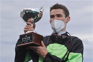 SYDNEY, AUSTRALIA - OCTOBER 02: Regan Bayliss poses with the Epsom trophy after winning race 8 the TAB Epsom on Private Eye during Sydney Racing at Royal Randwick Racecourse on October 02, 2021 in Sydney, Australia. (Photo by Mark Evans/Getty Images)