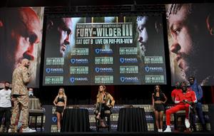 LAS VEGAS, NEVADA - OCTOBER 06: Broadcaster Kate Abdo (C) moderates a news conference for WBC heavyweight champion Tyson Fury (L) and Deontay Wilder (2nd R) at MGM Grand Garden Arena on October 6, 2021 in Las Vegas, Nevada. Fury will defend his title against Wilder on October 9 at T-Mobile Arena in Las Vegas. (Getty Images)