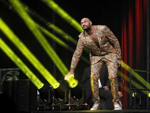 LAS VEGAS, NEVADA - OCTOBER 06: WBC heavyweight champion Tyson Fury plays with a light during a news conference at MGM Grand Garden Arena on October 6, 2021 in Las Vegas, Nevada. Fury will defend his title against Deontay Wilder on October 9 at T-Mobile Arena in Las Vegas. (Getty Images)