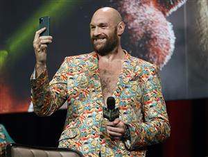 LAS VEGAS, NEVADA - OCTOBER 06: WBC heavyweight champion Tyson Fury records himself on a cell phone during a news conference at MGM Grand Garden Arena on October 6, 2021 in Las Vegas, Nevada. Fury will defend his title against Deontay Wilder on October 9 at T-Mobile Arena in Las Vegas. (Getty Images)