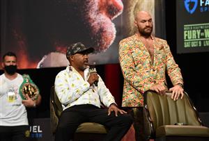 WBC heavyweight champion Tyson Fury (L) of Great Britain and his trainer SugarHill Steward (C) attend a news conference at the MGM Grand Garden Arena on October 6, 2021 in Las Vegas, Nevada. - Fury will defend his title against US challenger Deontay Wilder on October 9, 2021 at T-Mobile Arena in Las Vegas. (Getty Images)