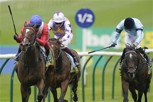 NEWMARKET, ENGLAND - OCTOBER 08: Frankie Dettori riding Inspiral (red) win The bet365 Fillies' Mile at Newmarket Racecourse on October 08, 2021 in Newmarket, England. (Photo by Alan Crowhurst/Getty Images)