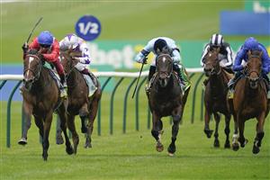 NEWMARKET, ENGLAND - OCTOBER 08: Frankie Dettori riding Inspiral (red) win The bet365 Fillies' Mile at Newmarket Racecourse on October 08, 2021 in Newmarket, England. (Photo by Alan Crowhurst/Getty Images)