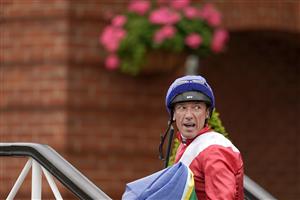 NEWMARKET, ENGLAND - OCTOBER 08: Frankie Dettori poses at Newmarket Racecourse on October 08, 2021 in Newmarket, England. (Photo by Alan Crowhurst/Getty Images)