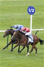 NEWMARKET, ENGLAND - OCTOBER 08: James Doyle riding Fast Attack (red) win The Godolphin Lifetime Care Oh So Sharp Stakes from Jim Crowley and Allayaali (blue) at Newmarket Racecourse on October 08, 2021 in Newmarket, England. (Photo by Alan Crowhurst/Getty Images)