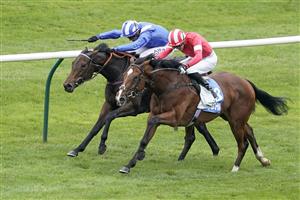 NEWMARKET, ENGLAND - OCTOBER 08: James Doyle riding Fast Attack (red) win The Godolphin Lifetime Care Oh So Sharp Stakes from Jim Crowley and Allayaali (blue) at Newmarket Racecourse on October 08, 2021 in Newmarket, England. (Photo by Alan Crowhurst/Getty Images)