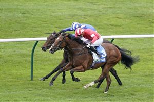 NEWMARKET, ENGLAND - OCTOBER 08: James Doyle riding Fast Attack (red) win The Godolphin Lifetime Care Oh So Sharp Stakes from Jim Crowley and Allayaali (blue) at Newmarket Racecourse on October 08, 2021 in Newmarket, England. (Photo by Alan Crowhurst/Getty Images)