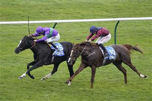 NEWMARKET, ENGLAND - OCTOBER 08: Richard Kingscote riding Ville De Grace (L) win The Newmarket Pony Academy Pride Stakes at Newmarket Racecourse on October 08, 2021 in Newmarket, England. (Photo by Alan Crowhurst/Getty Images)