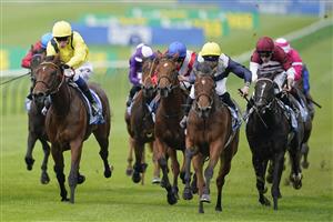 NEWMARKET, ENGLAND - OCTOBER 08: Neil Callan riding Ribbon Rose (R, yellow cap) win The Godolphin Under Starters Orders Maiden Fillies' Stakes at Newmarket Racecourse on October 08, 2021 in Newmarket, England. (Photo by Alan Crowhurst/Getty Images)