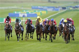 NEWMARKET, ENGLAND - OCTOBER 08: Neil Callan riding Ribbon Rose (R, yellow cap) win The Godolphin Under Starters Orders Maiden Fillies' Stakes at Newmarket Racecourse on October 08, 2021 in Newmarket, England. (Photo by Alan Crowhurst/Getty Images)