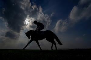 NEWMARKET, ENGLAND - OCTOBER 09: A general view as runners ease down after finishing The Dubai Nursery at Newmarket Racecourse on October 09, 2021 in Newmarket, England. (Photo by Alan Crowhurst/Getty Images)