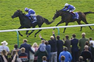 NEWMARKET, ENGLAND - OCTOBER 09: Jim Crowley riding Mostahdaf (L) win The Darley Stakes at Newmarket Racecourse on October 09, 2021 in Newmarket, England. (Photo by Alan Crowhurst/Getty Images)