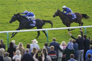 NEWMARKET, ENGLAND - OCTOBER 09: Jim Crowley riding Mostahdaf (L) win The Darley Stakes at Newmarket Racecourse on October 09, 2021 in Newmarket, England. (Photo by Alan Crowhurst/Getty Images)