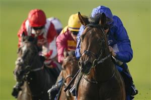 NEWMARKET, ENGLAND - OCTOBER 09: William Buick riding Native Trail (blue) win The Darley Dewhurst Stakes at Newmarket Racecourse on October 09, 2021 in Newmarket, England. (Photo by Alan Crowhurst/Getty Images)
