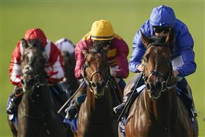 NEWMARKET, ENGLAND - OCTOBER 09: William Buick riding Native Trail (blue) win The Darley Dewhurst Stakes at Newmarket Racecourse on October 09, 2021 in Newmarket, England. (Photo by Alan Crowhurst/Getty Images)