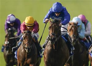 NEWMARKET, ENGLAND - OCTOBER 09: William Buick riding Native Trail (blue) win The Darley Dewhurst Stakes at Newmarket Racecourse on October 09, 2021 in Newmarket, England. (Photo by Alan Crowhurst/Getty Images)