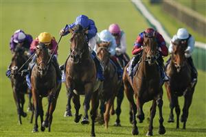 NEWMARKET, ENGLAND - OCTOBER 09: William Buick riding Native Trail (C, blue) win The Darley Dewhurst Stakes at Newmarket Racecourse on October 09, 2021 in Newmarket, England. (Photo by Alan Crowhurst/Getty Images)