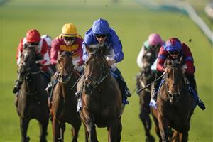 NEWMARKET, ENGLAND - OCTOBER 09: William Buick riding Native Trail (C, blue) win The Darley Dewhurst Stakes at Newmarket Racecourse on October 09, 2021 in Newmarket, England. (Photo by Alan Crowhurst/Getty Images)