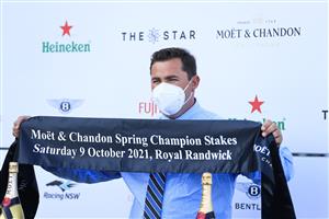SYDNEY, AUSTRALIA - OCTOBER 09: Trainer Richard Litt holds up the sash after winning race 8 the Moet & Chandon Spring Champion Stakes with Profondo during Sydney Racing at Royal Randwick Racecourse on October 09, 2021 in Sydney, Australia. (Photo by Mark Evans/Getty Images)